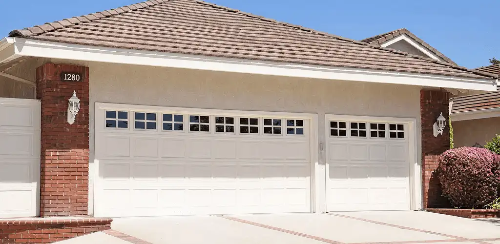 Residential garage door repair service for a double garage door in Des Moines, IA
