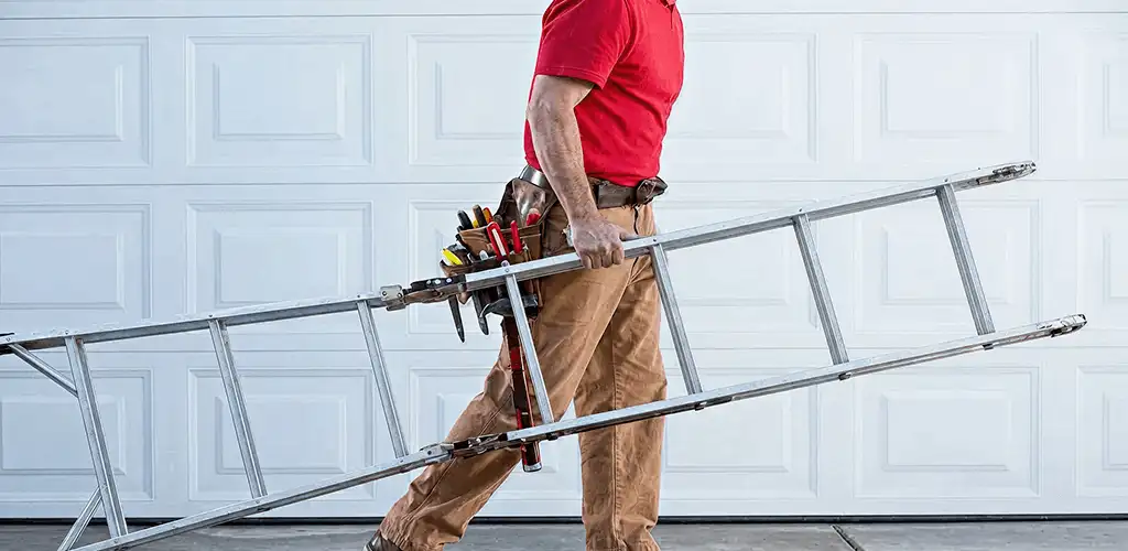 Garage door repair technician arriving with tools and ladder in Des Moines, IA